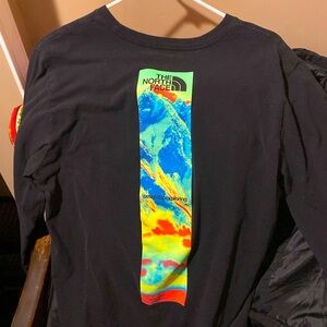 The north face black, long sleeve L T-shirt, with design on back logo on front
